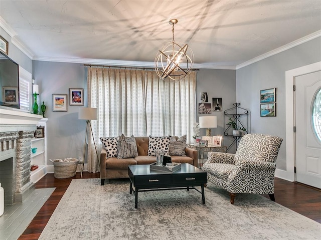 1122 NW 42nd St, Oklahoma City, OK 73118 - living room with a chandelier, ornamental molding, dark wood-type flooring, and a stone fireplace