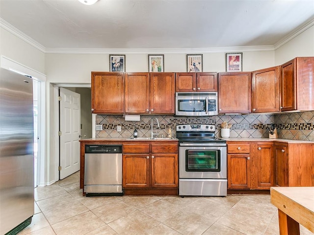 1122 NW 42nd St, Oklahoma City, OK 73118 - kitchen with stainless steel appliances, ornamental molding, backsplash, light countertops, and light tile patterned flooring