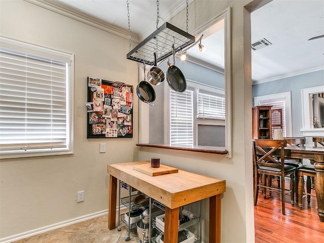 1122 NW 42nd St, Oklahoma City, OK 73118 - dining area featuring ornamental molding and healthy amount of natural light