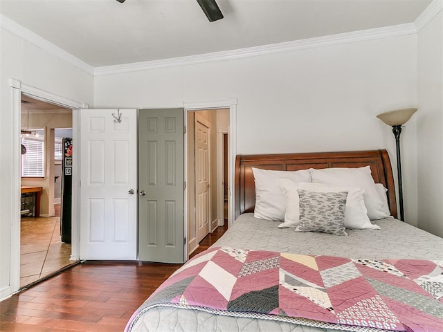 1122 NW 42nd St, Oklahoma City, OK 73118 - bedroom with hardwood / wood-style flooring, ornamental molding, and a ceiling fan