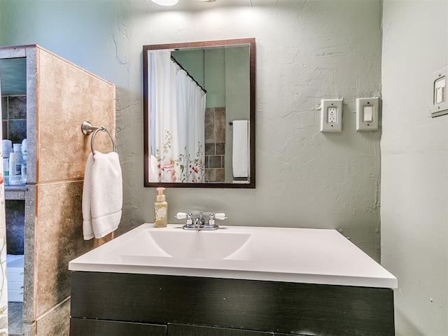 1122 NW 42nd St, Oklahoma City, OK 73118 - bathroom with vanity and a textured wall