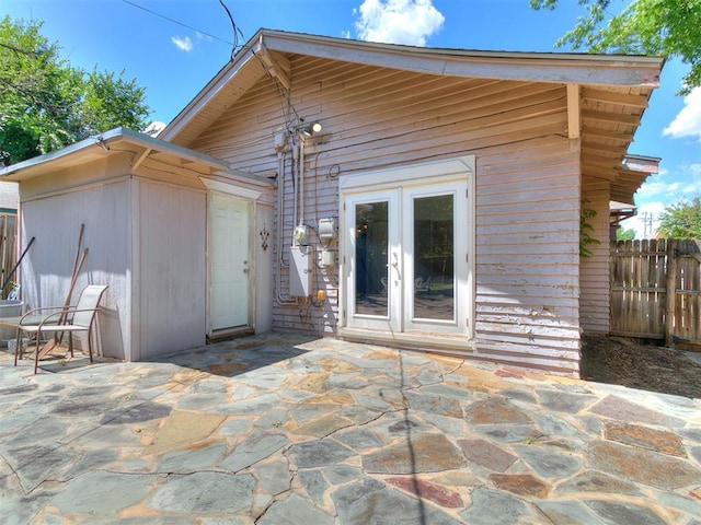 1122 NW 42nd St, Oklahoma City, OK 73118 - rear view of property with a patio area and french doors