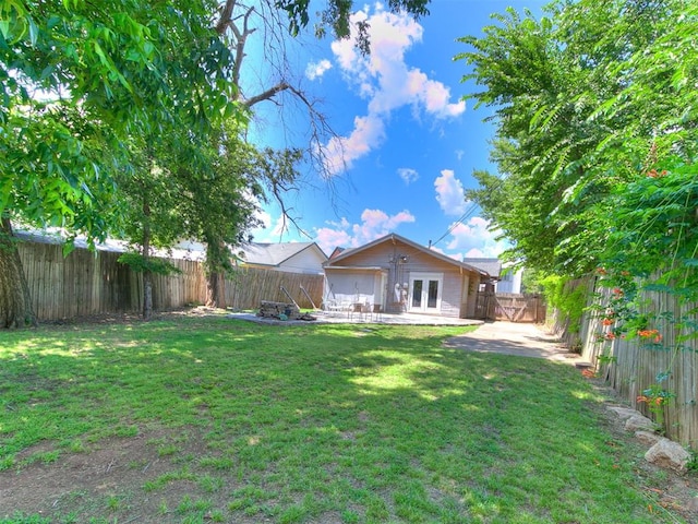 1122 NW 42nd St, Oklahoma City, OK 73118 - back of property with french doors, a patio, and a fenced backyard
