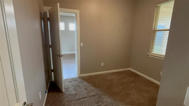 11321 NW 102nd St, Yukon, OK 73099 - spare room with carpet floors and baseboards