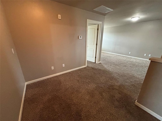 11321 NW 102nd St, Yukon, OK 73099 - empty room with dark colored carpet and baseboards