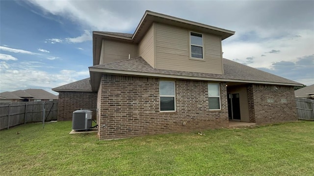 11321 NW 102nd St, Yukon, OK 73099 - rear view of house featuring brick siding and a shingled roof