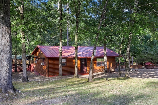 17 Halibut Bay Rd, Broken Bow, OK 74728 - view of front of property featuring log veneer siding, a metal roof, and covered porch