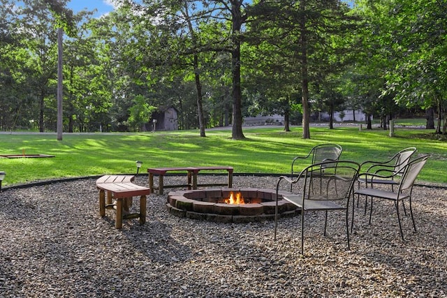 17 Halibut Bay Rd, Broken Bow, OK 74728 - view of home's community with an outdoor fire pit, a yard, and view of scattered trees
