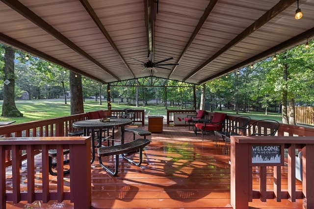 17 Halibut Bay Rd, Broken Bow, OK 74728 - wooden deck with a ceiling fan, view of wooded area, and a lawn