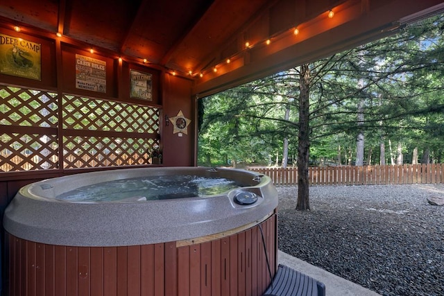 17 Halibut Bay Rd, Broken Bow, OK 74728 - miscellaneous room with a jacuzzi, vaulted ceiling, and view of wooded area