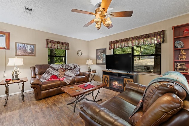 17 Halibut Bay Rd, Broken Bow, OK 74728 - living area featuring a ceiling fan, a textured ceiling, and wood finished floors