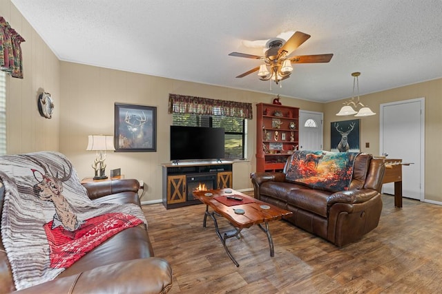 17 Halibut Bay Rd, Broken Bow, OK 74728 - living room with wood finished floors, a ceiling fan, and a textured ceiling