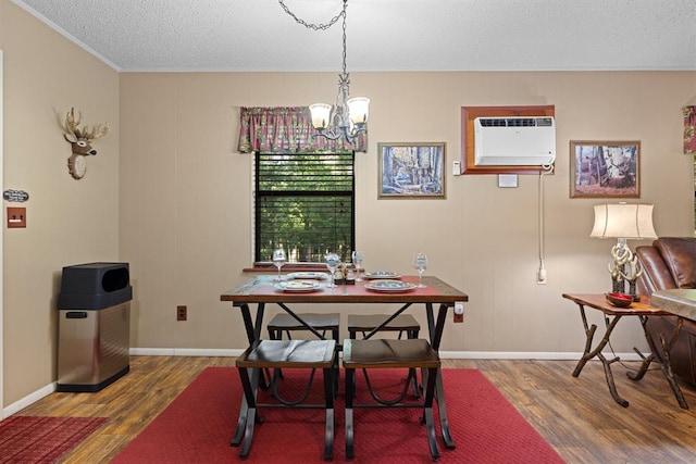 17 Halibut Bay Rd, Broken Bow, OK 74728 - dining room with a chandelier, wood finished floors, crown molding, a textured ceiling, and a wall unit AC
