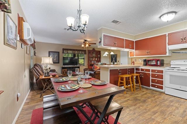 17 Halibut Bay Rd, Broken Bow, OK 74728 - dining space with a ceiling fan, light wood-style flooring, a textured ceiling, a chandelier, and an AC wall unit