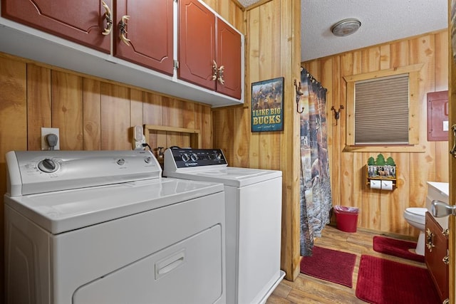 17 Halibut Bay Rd, Broken Bow, OK 74728 - laundry room featuring wood walls, washer and dryer, and light wood-style floors