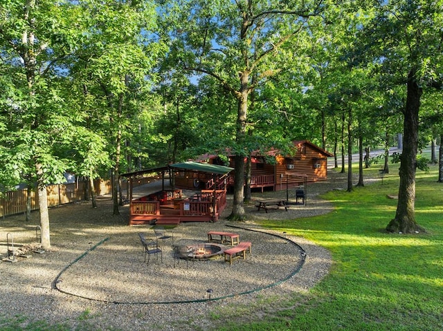 17 Halibut Bay Rd, Broken Bow, OK 74728 - view of yard featuring an outdoor fire pit and a wooden deck