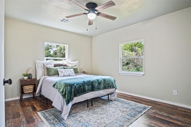 102078 S 3480th Rd, Meeker, OK 74855 - bedroom featuring multiple windows, wood finished floors, and a ceiling fan