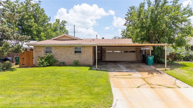 1512 SW 77th Ter, Oklahoma City, OK 73159 - ranch-style house with an attached carport, concrete driveway, and brick siding