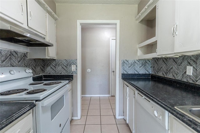 1512 SW 77th Ter, Oklahoma City, OK 73159 - kitchen featuring white appliances, under cabinet range hood, light tile patterned floors, dark countertops, and white cabinetry