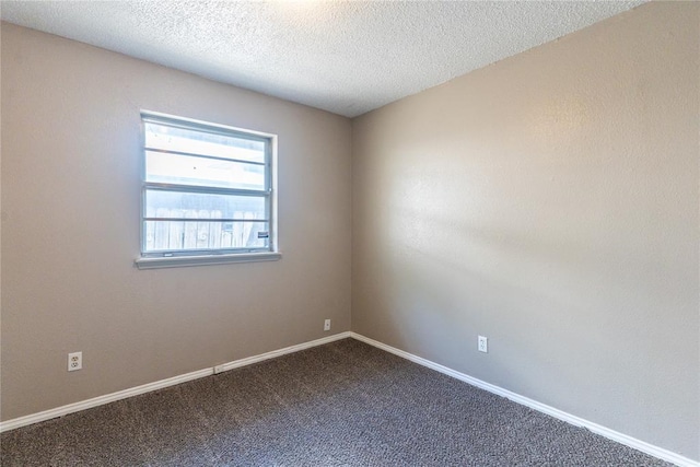 1512 SW 77th Ter, Oklahoma City, OK 73159 - empty room featuring dark colored carpet and a textured ceiling