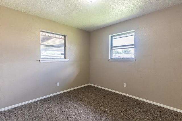 1512 SW 77th Ter, Oklahoma City, OK 73159 - spare room featuring dark colored carpet and a textured ceiling