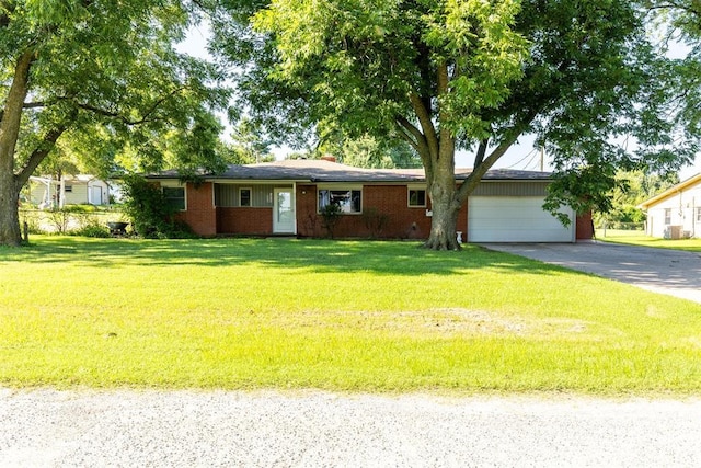 13722 NE 9th St, Choctaw, OK 73020 - ranch-style house featuring concrete driveway, an attached garage, a front yard, and brick siding