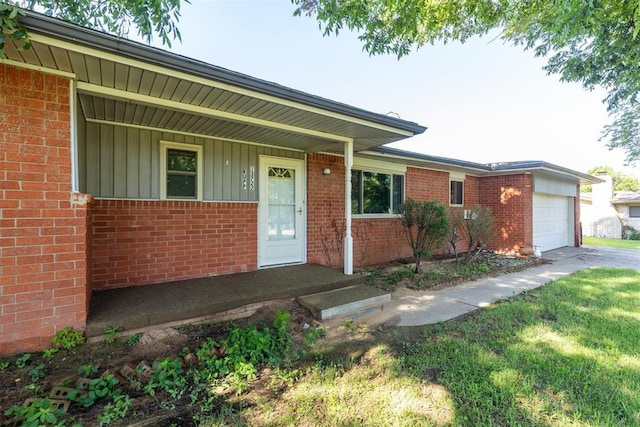 13722 NE 9th St, Choctaw, OK 73020 - ranch-style home featuring board and batten siding, brick siding, an attached garage, and a front yard