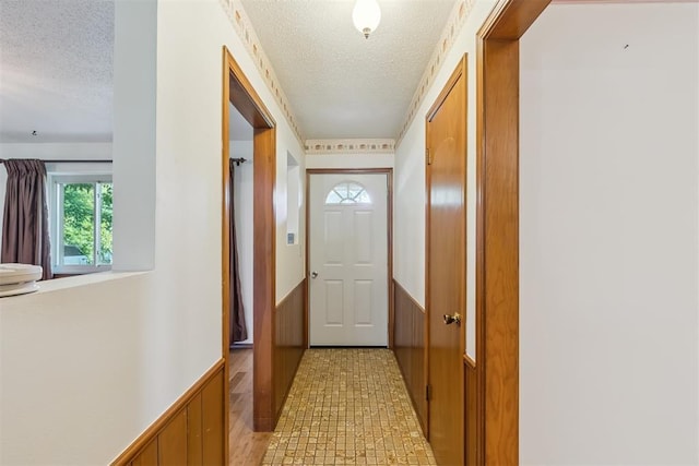 13722 NE 9th St, Choctaw, OK 73020 - entryway with a textured ceiling and a wainscoted wall