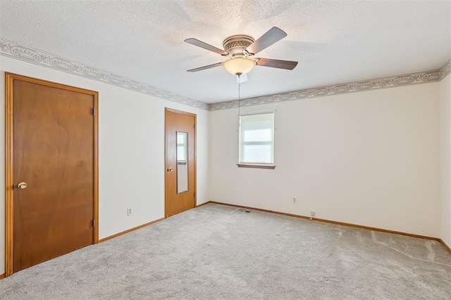13722 NE 9th St, Choctaw, OK 73020 - unfurnished bedroom with carpet floors, a textured ceiling, and ceiling fan