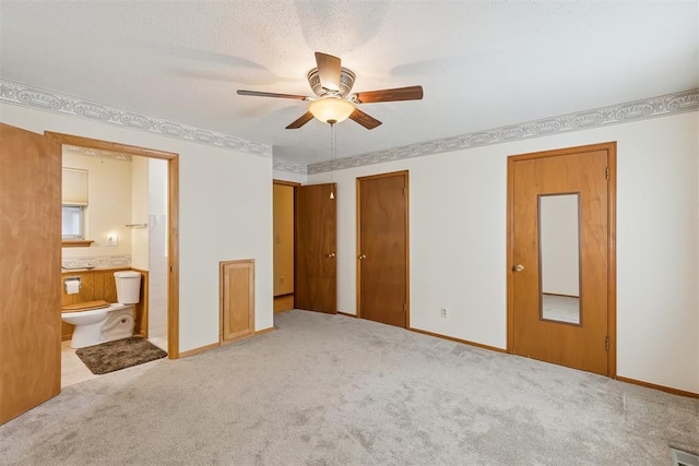 13722 NE 9th St, Choctaw, OK 73020 - unfurnished bedroom featuring carpet flooring, ensuite bathroom, and ceiling fan