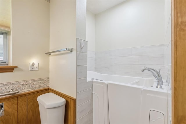 13722 NE 9th St, Choctaw, OK 73020 - full bathroom with a bath and a wainscoted wall