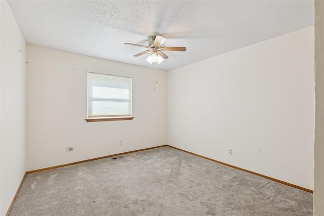 13722 NE 9th St, Choctaw, OK 73020 - unfurnished room featuring a ceiling fan, carpet, and a textured ceiling