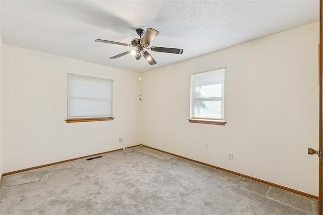 13722 NE 9th St, Choctaw, OK 73020 - carpeted spare room featuring baseboards and ceiling fan