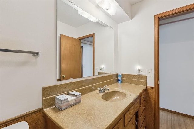 13722 NE 9th St, Choctaw, OK 73020 - bathroom with vanity, wainscoting, and wood finished floors