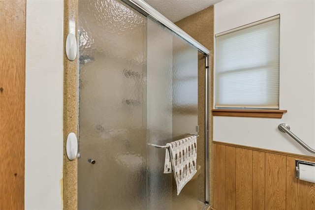 13722 NE 9th St, Choctaw, OK 73020 - bathroom featuring a stall shower and wainscoting