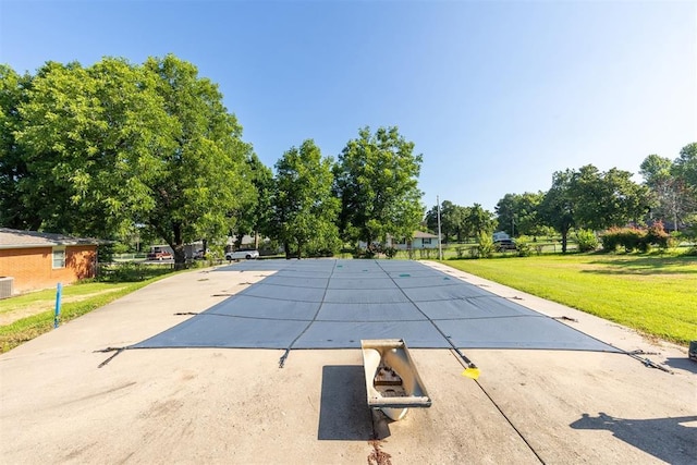 13722 NE 9th St, Choctaw, OK 73020 - view of swimming pool with a lawn, a covered pool, and a patio