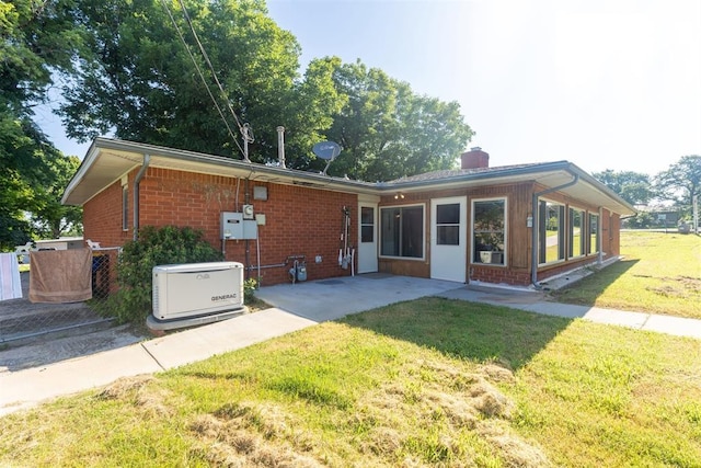 13722 NE 9th St, Choctaw, OK 73020 - back of house featuring brick siding, a patio, a yard, and a chimney