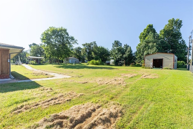 13722 NE 9th St, Choctaw, OK 73020 - view of grassy yard with an outdoor structure