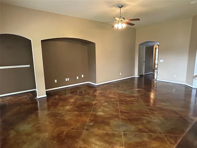 1108 SW 158th St, Oklahoma City, OK 73170 - tiled spare room featuring ceiling fan and arched walkways
