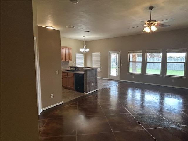 1108 SW 158th St, Oklahoma City, OK 73170 - kitchen with a chandelier, open floor plan, a ceiling fan, dishwasher, and dark tile patterned floors