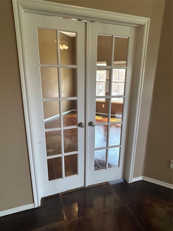 1108 SW 158th St, Oklahoma City, OK 73170 - detailed view of french doors and baseboards