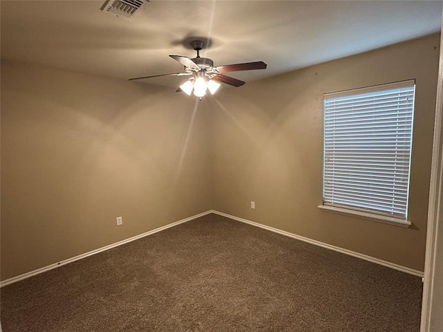 1108 SW 158th St, Oklahoma City, OK 73170 - spare room with ceiling fan and dark carpet