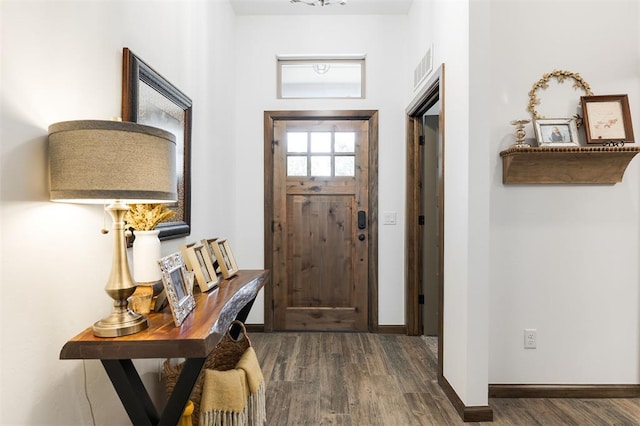 13 Ivory Dr, Yukon, OK 73099 - foyer entrance featuring wood finished floors and baseboards