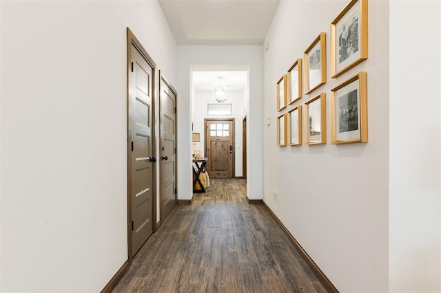 13 Ivory Dr, Yukon, OK 73099 - hall with dark wood-style floors and a chandelier