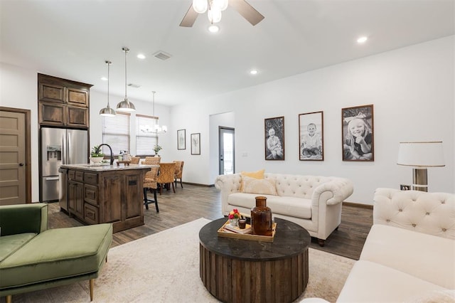 13 Ivory Dr, Yukon, OK 73099 - living room featuring wood finished floors, a chandelier, a ceiling fan, and recessed lighting