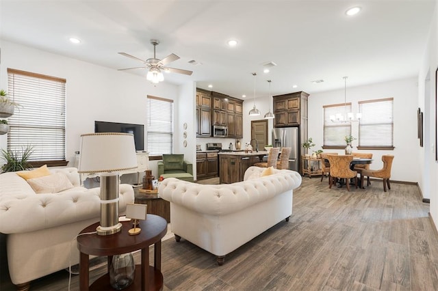 13 Ivory Dr, Yukon, OK 73099 - living area with wood finished floors, ceiling fan, recessed lighting, and a chandelier