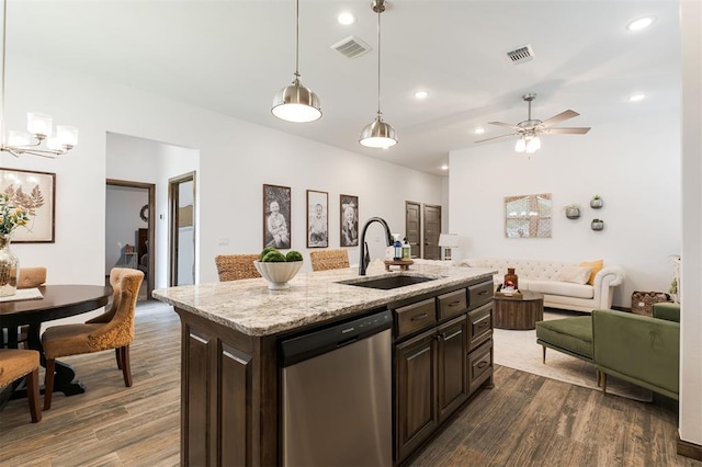 13 Ivory Dr, Yukon, OK 73099 - kitchen featuring stainless steel dishwasher, dark wood-type flooring, open floor plan, dark brown cabinets, and recessed lighting