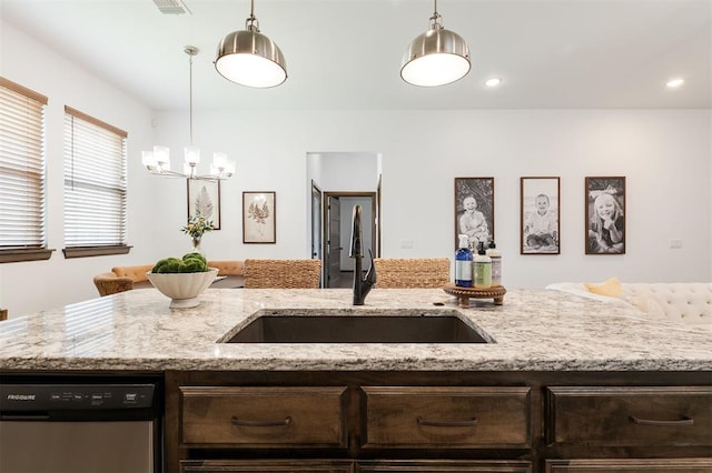 13 Ivory Dr, Yukon, OK 73099 - kitchen featuring stainless steel dishwasher, dark brown cabinets, open floor plan, a chandelier, and recessed lighting