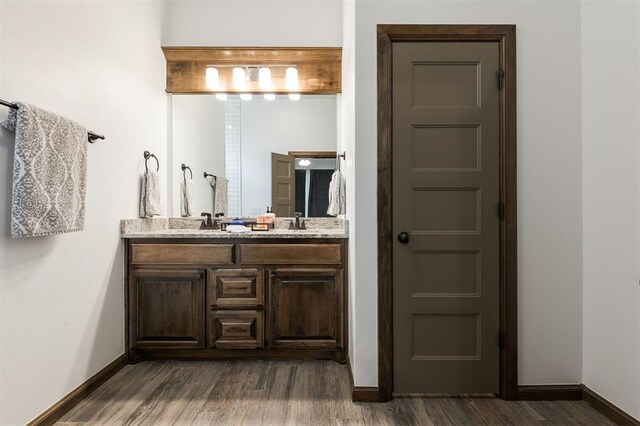 13 Ivory Dr, Yukon, OK 73099 - full bathroom featuring double vanity and wood finished floors
