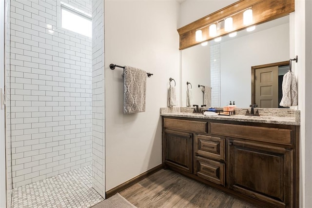 13 Ivory Dr, Yukon, OK 73099 - bathroom with a walk in shower, double vanity, and wood finished floors